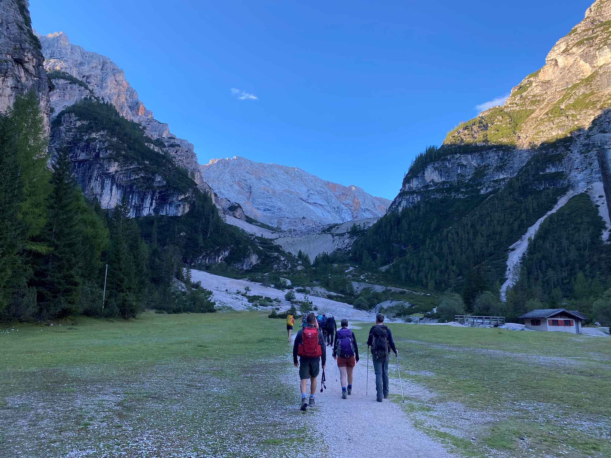 A group of people setting off on Day 2 from the Rifugio Pederu