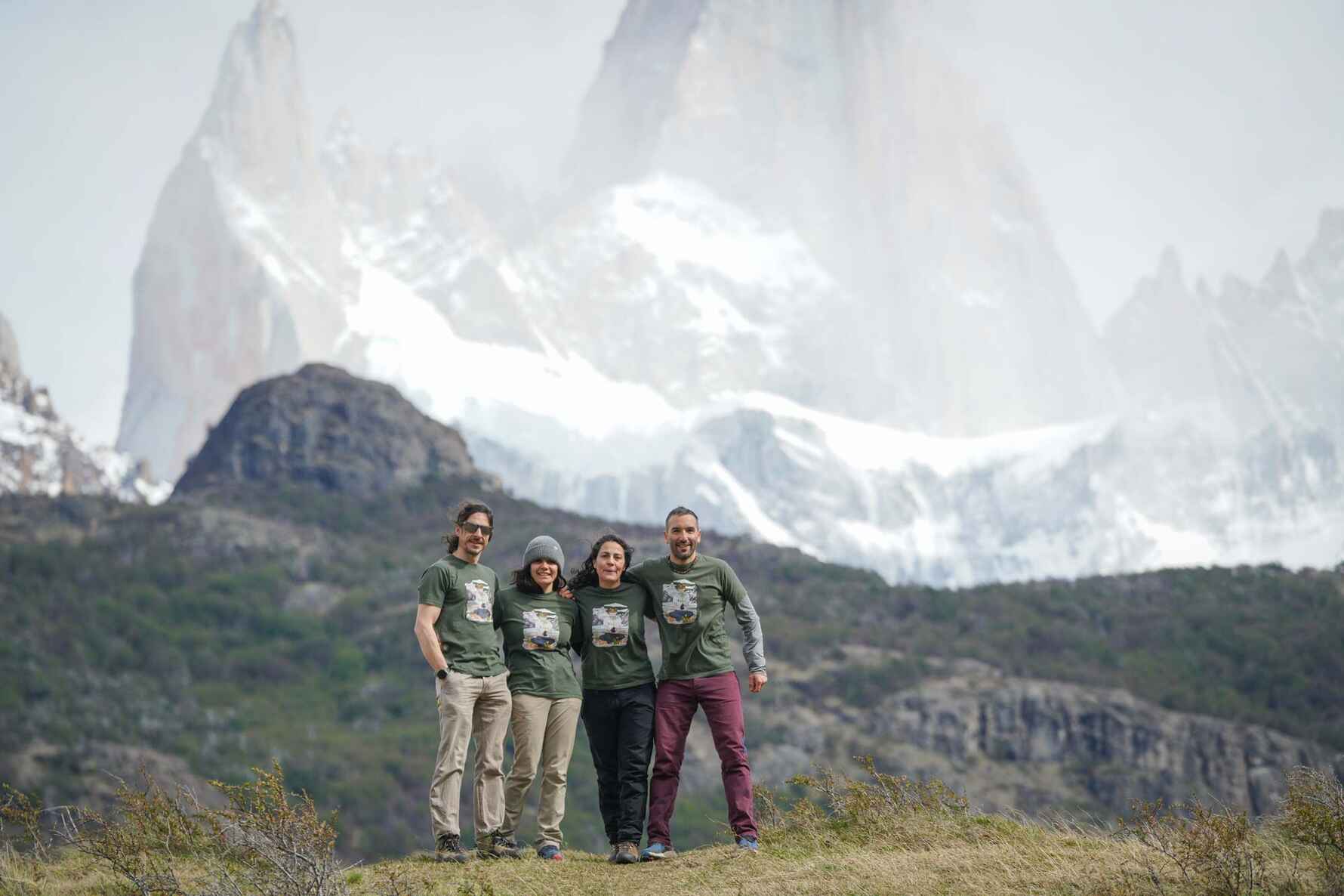 4 people shown with Mount Fitz in the background