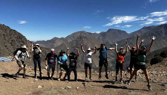 A group of hikers jumping in the air