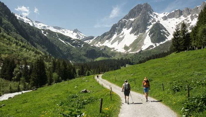 Hikers on a trail above Les Contamines